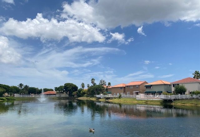 A lake and fountain within Coral Lakes