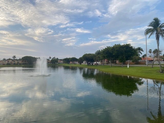 A community lake with a fountain at Coral Lakes